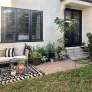 Home exterior with black windows and door